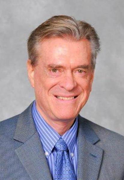 A person in a suit smiling

AI-generated content may be incorrect.