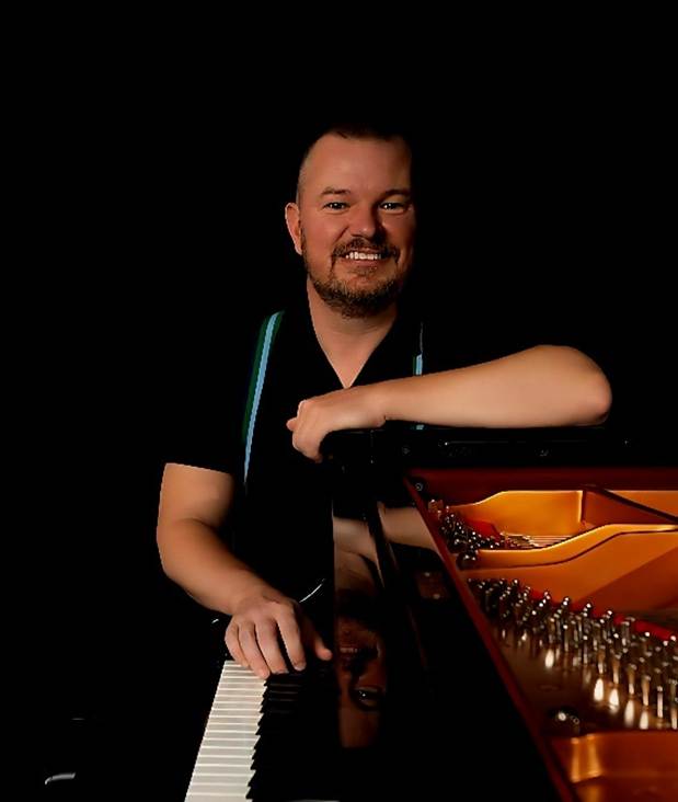 A person sitting at a piano